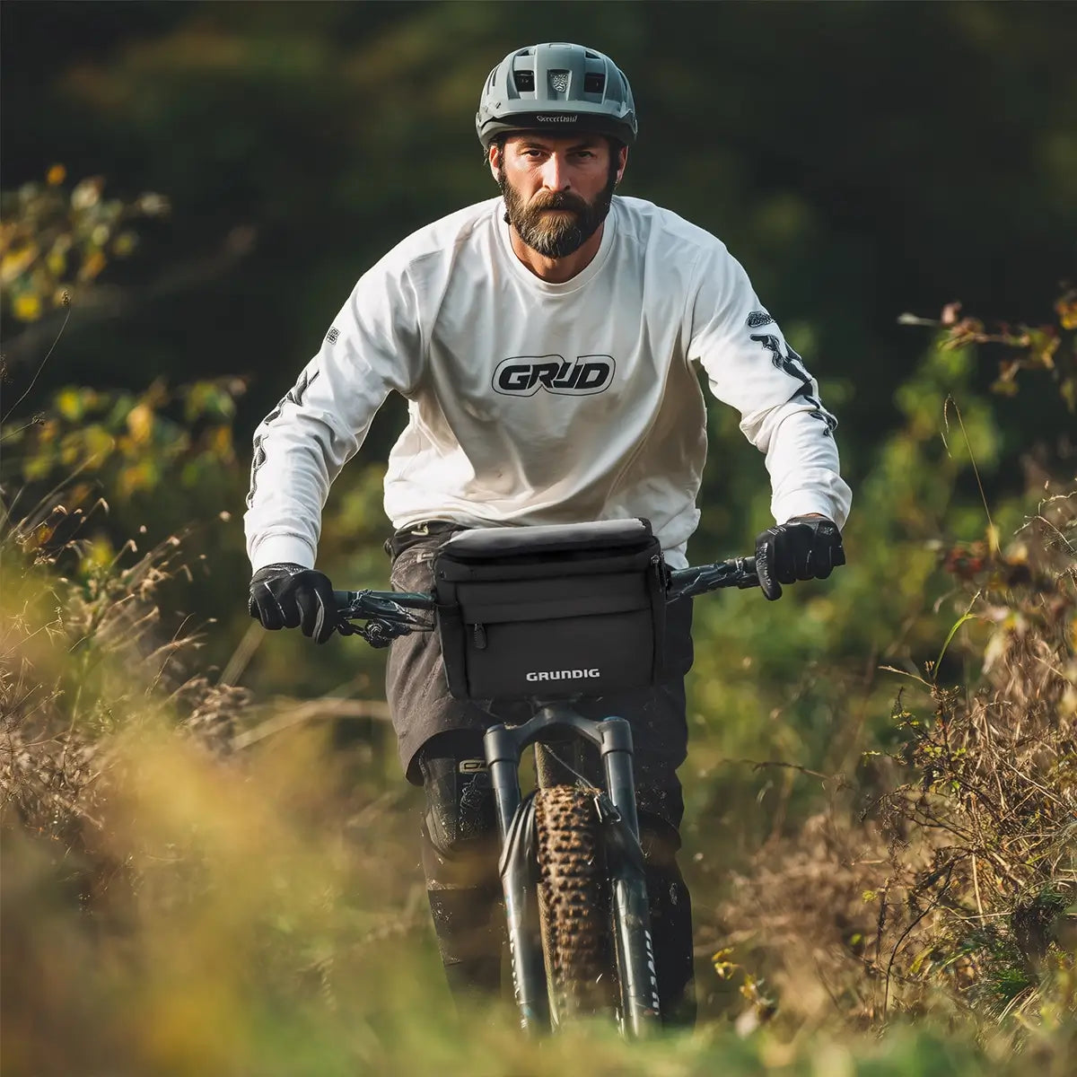 Waterproof 6L TPU insulated handlebar bag in outdoor cycling environment, mounted on bike during off-road adventure